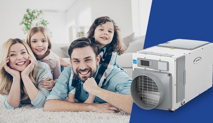 Happy family lying down on carpet featuring installed dehumidifiers for better indoor air quality
