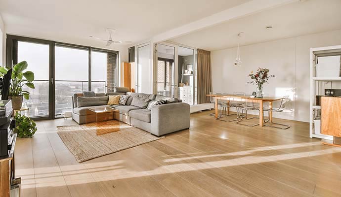 Clean and bright living and dining area with large windows